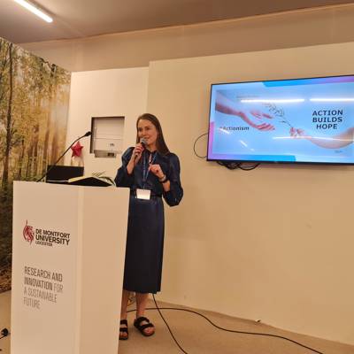 Kate Cubley presenting at COP28 in Dubai, UAE
